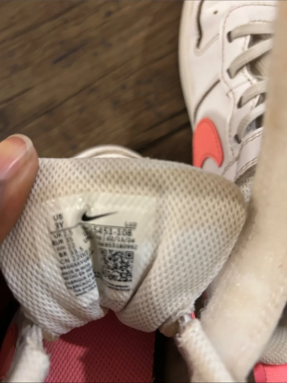 Nike Kids White Sneakers with Coral Swoosh and Yellow Tongue
